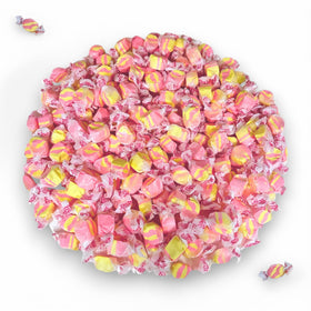 Assortit strawberry banana taffy party display at a candy table.