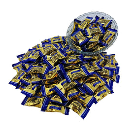 Assortit Werther's Original sugar-free hard caramel candies beside a coffee mug for a cozy break.