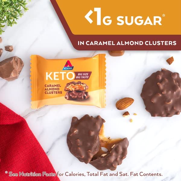 Carton display of Atkins Caramel Almond Clusters for family snacking.