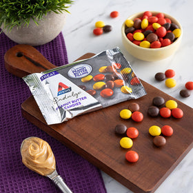 Two individually wrapped Atkins Endulge candies in a travel sleeve