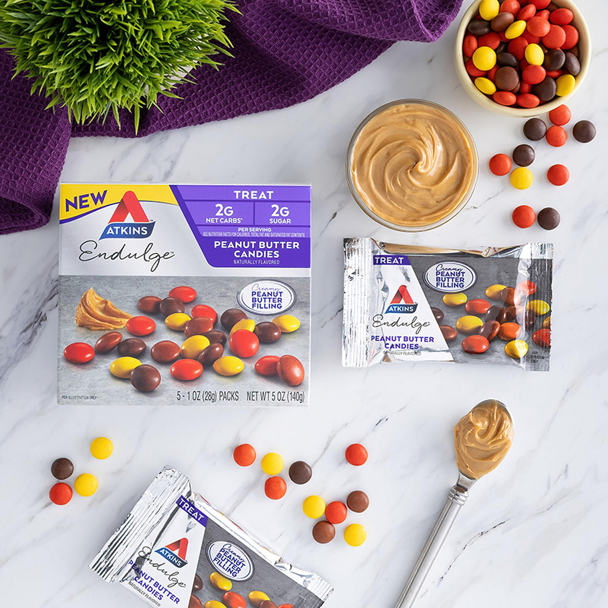 Opened box reveals creamy peanut butter filling in Atkins Endulge candies