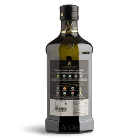 Atlas Organic EVOO bottle pours over salad for vibrant finish