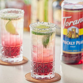 ATREVO Desert Pear Syrup with dispenser, perfect for margaritas and sangrias.