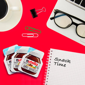 Nutella mini cups with spoons arranged for sharing at meetings