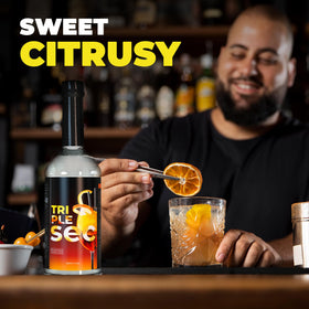 ATREVO orange syrup beside sparkling water suggests easy mixability for spritzers.