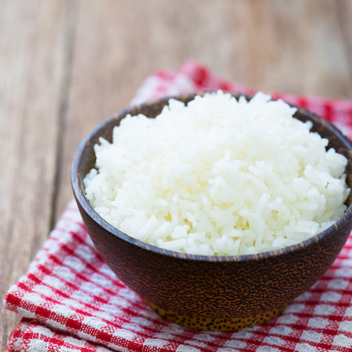 Cooking pot on a stove with Augason Farms long-grain white rice.