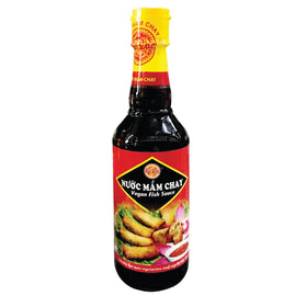 Au Lac Vegan Fish Sauce bottle pour adds savory depth to vegan dishes.
