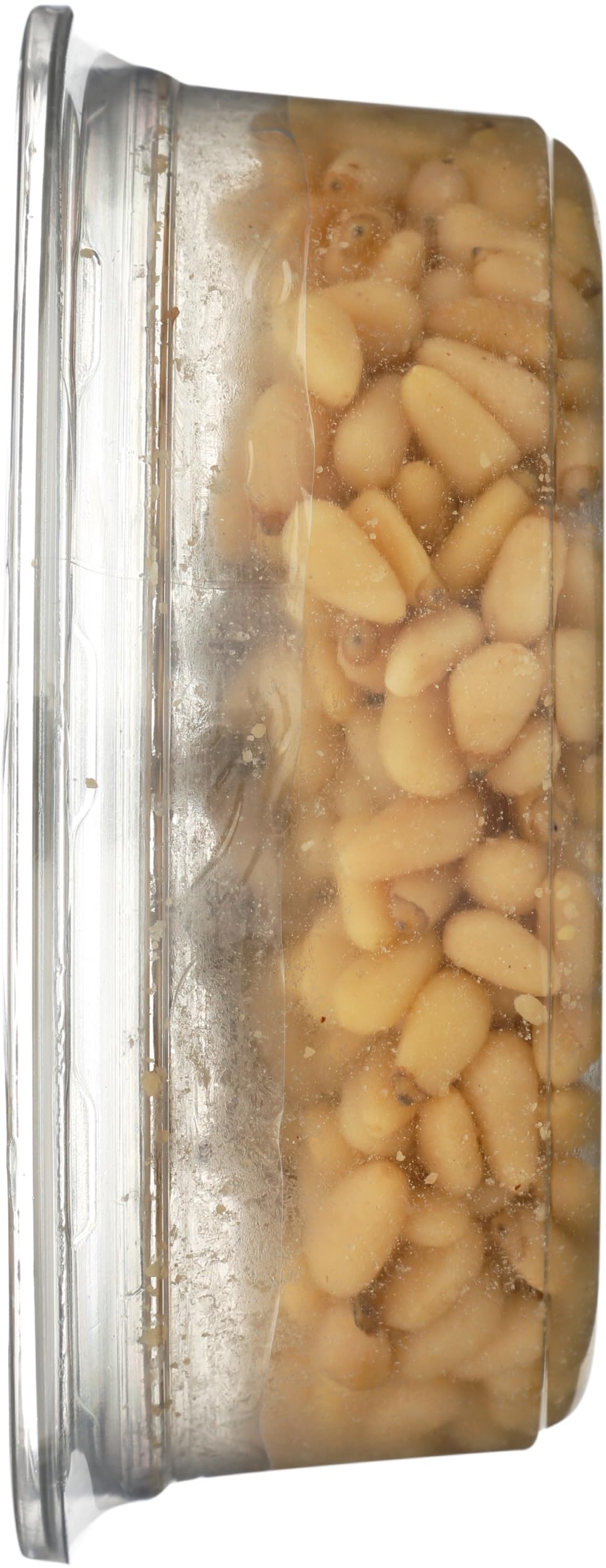 Aurora Pine nuts on a green salad, brightening flavors with crunch.