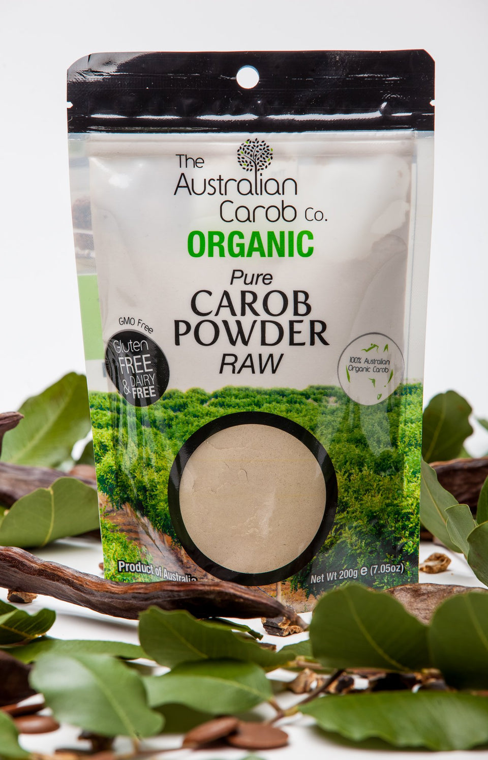 The Australian Carob Co. raw organic carob powder being poured for quick, versatile mix-ins.
