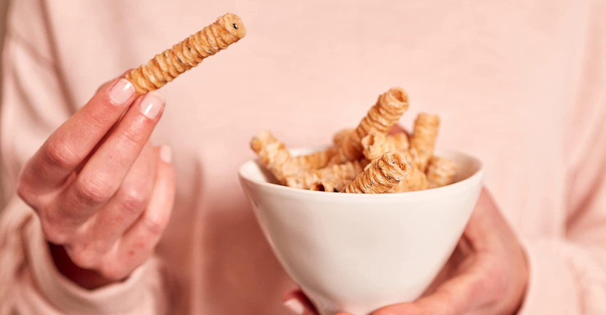Lightly sweetened baked coconut crisps by Ava Organics satisfying guilt-free cravings.