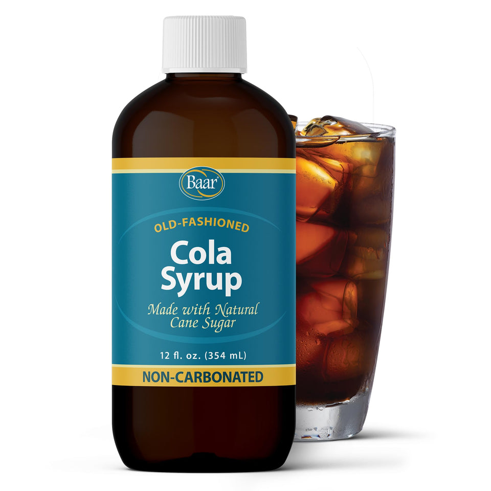 Baar Cola Syrup bottle on the counter ready for quick, caffeine-free mixing.