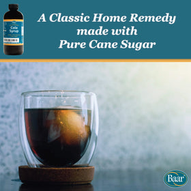 Close-up of Baar Cola Syrup label highlighting cane sugar and caffeine-free formula.