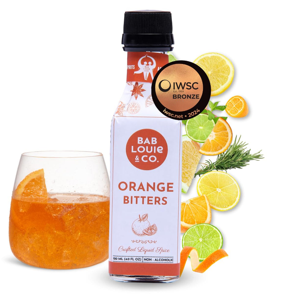 Bab Louie & Co. Orange Bitters bottle on bar cart for enhanced citrus notes.
