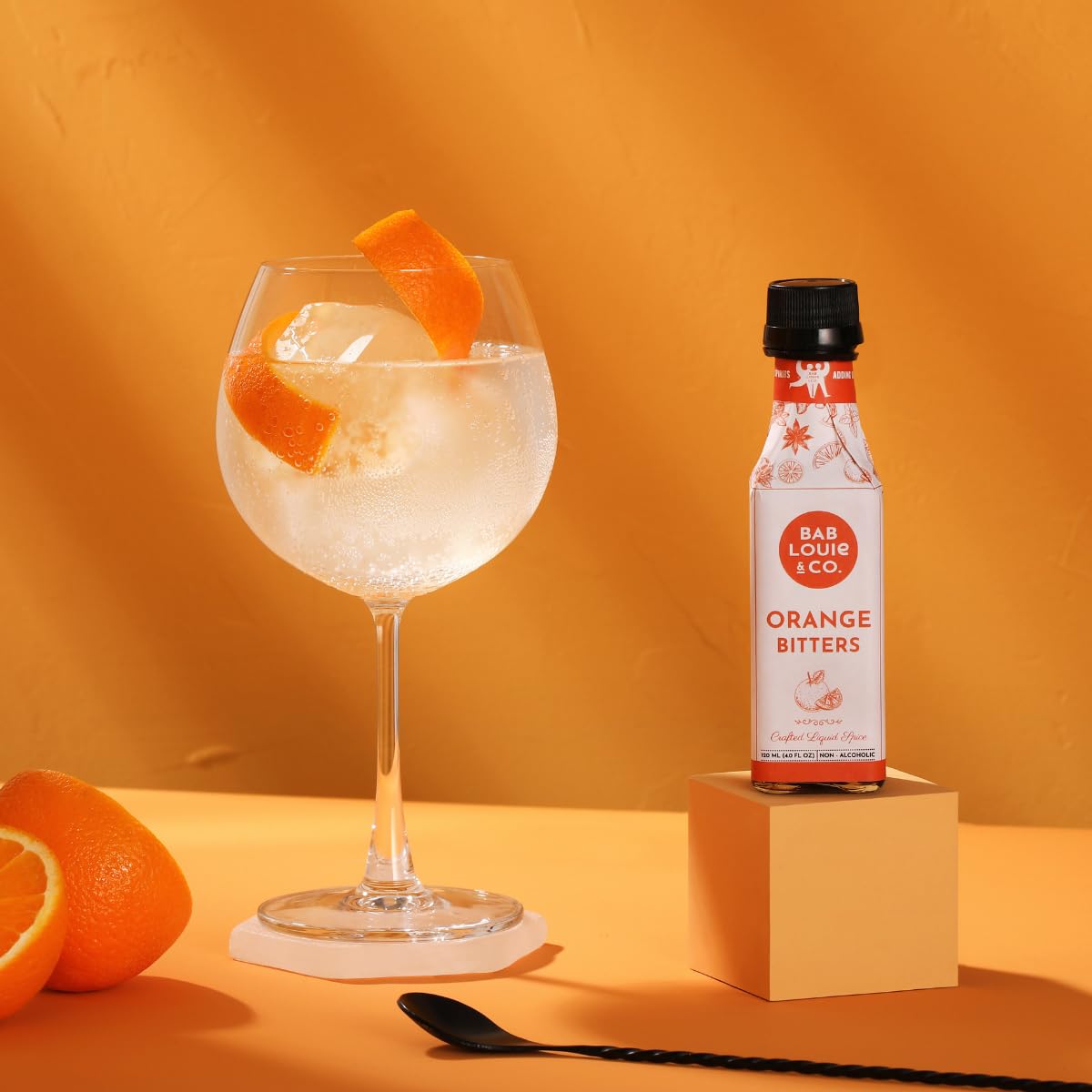 Close-up of Bab Louie & Co. Orange Bitters adding depth to cocktails.