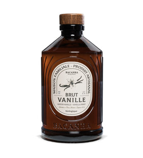 Bacanha Organic Vanilla Syrup bottle on a café setup, ideal for premium coffee.