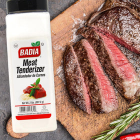 Badia Meat Tenderizer sprinkled on steak for juicier, tastier grilling results.