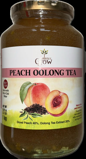 Balance Grow peach tea with lemon garnish ready to serve.
