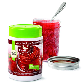 Ball Realfruit pectin pack open with powder ready to thicken jams.