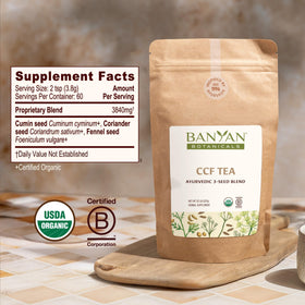 Banyan Botanicals CCF Tea brew cup shows warm, golden infusion for digestion.