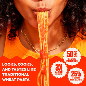 Cooked Banza penne plated with sauce shows fiber-rich, satisfying texture.