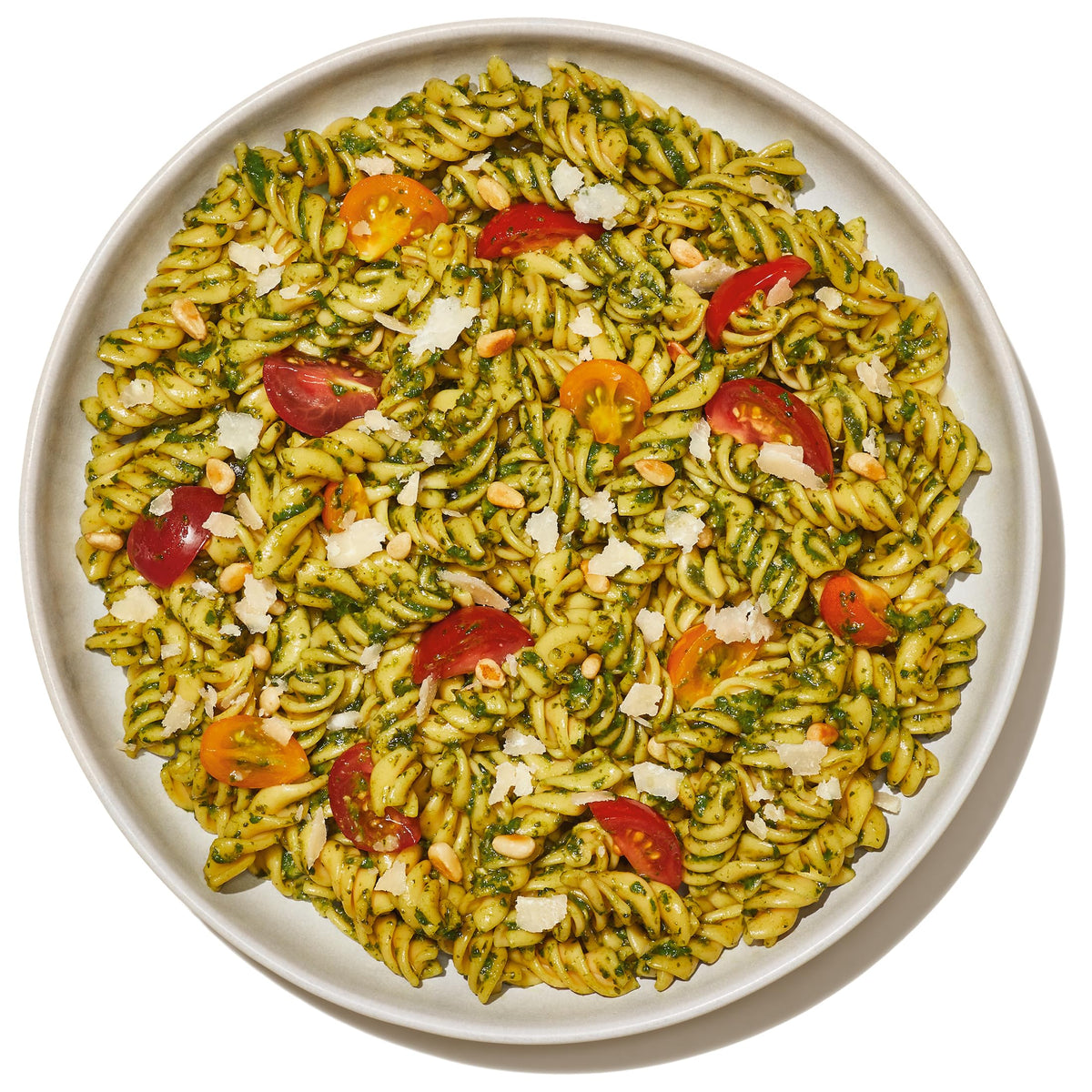 Plated Banza dish with sauce and greens displays inviting color and taste.