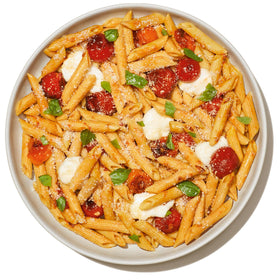 Assorted Banza shapes in a serving tray show versatile pasta options.
