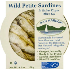 Bar Harbor sardines in EVOO being poured for a rich flavor boost.