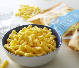 Barbara's Bakery Original Cheese Puffs close-up crunch highlighting real aged cheddar and blue cheese flavor, great party bites.
