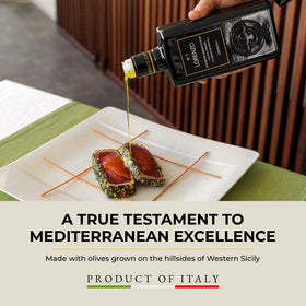 Barbera Lorenzo N° 1 olive oil being poured over a dish to showcase flavor