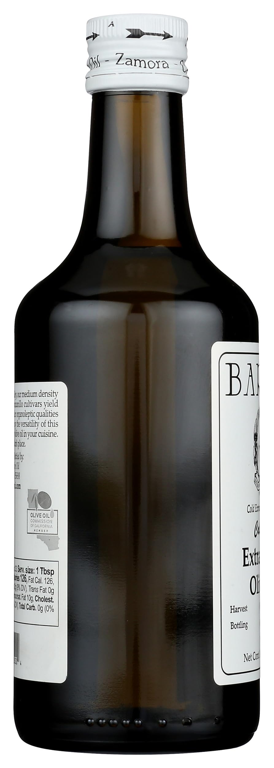 Bariani olive oil being poured over salad for brightness