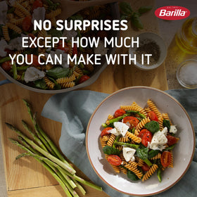 Barilla Chickpea Rotini pack of 10 boxes on shelf, convenient pantry staple.