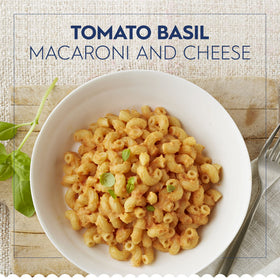 Barilla Elbows raw elbows close-up, ridged shape ideal for hearty sauces.