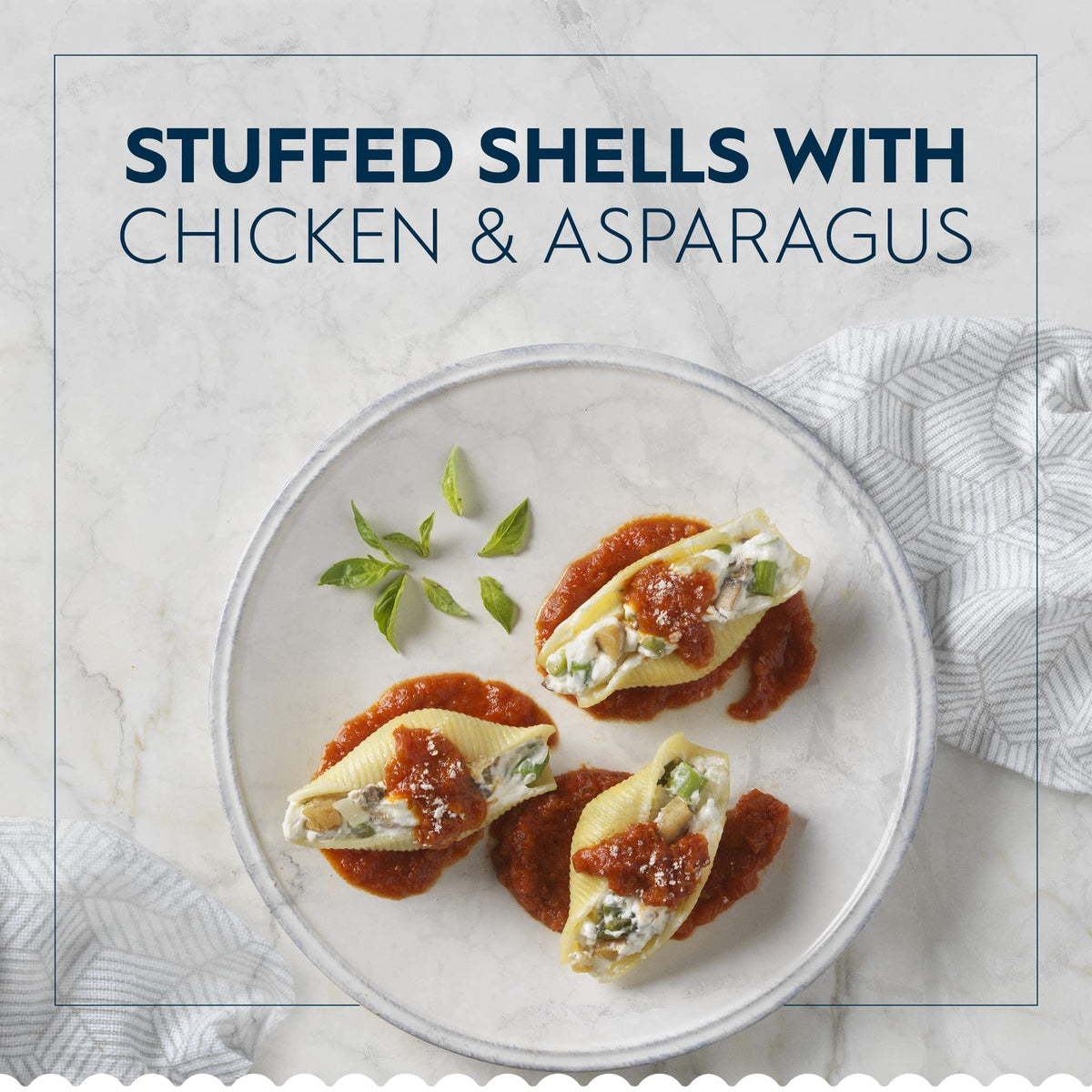 Open Barilla Jumbo Shells package showing large shells ready to stuff.