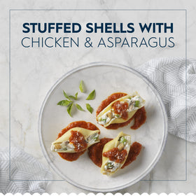 Open Barilla Jumbo Shells package showing large shells ready to stuff.