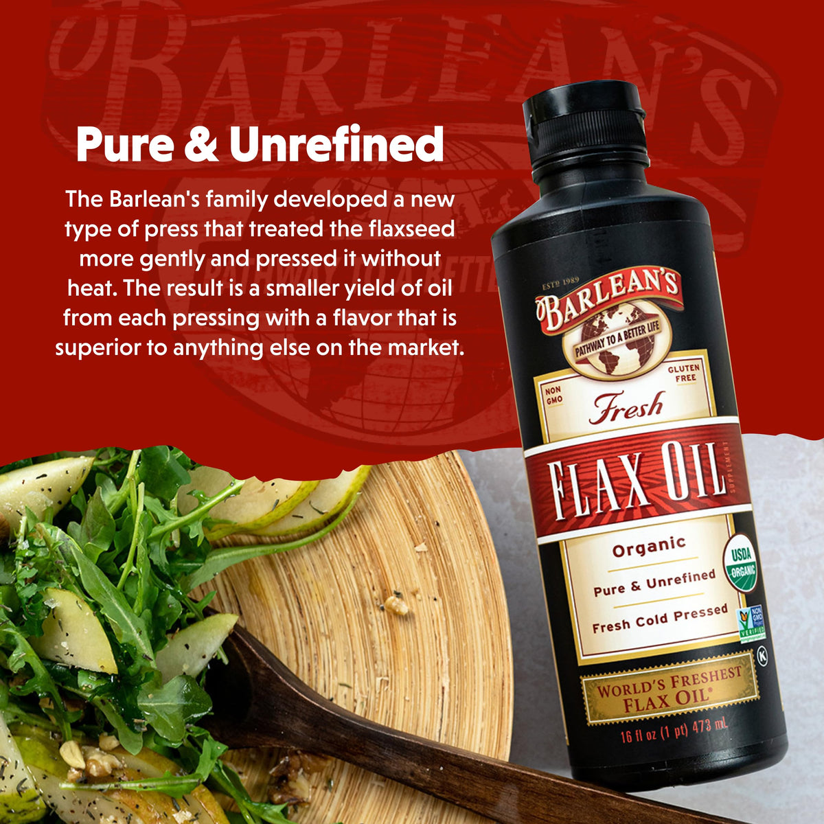 Barlean's flaxseed oil bottle next to fresh greens for salads