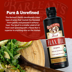 Barlean's flaxseed oil bottle next to fresh greens for salads