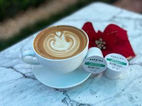 Close-up Barnies 100% Arabica beans signal premium coffee.