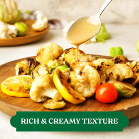 Tahini dressing drizzle over greens from Baron's adds nutty depth.