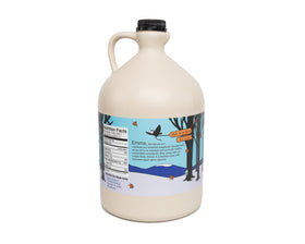Barred Woods Vermont maple syrup amber rich color in glass bottle highlights purity.
