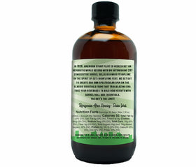 Open bottle with mint sprig suggests fresh, natural ingredients for shaken or stirred drinks.