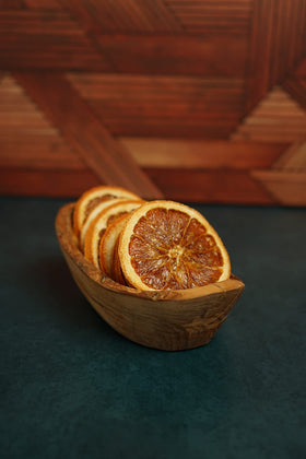 Barrel Roll orange slices adding natural citrus aroma to cocktails and mocktails.