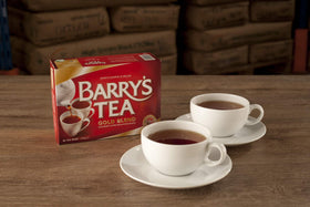 Barry's Tea Gold Blend tea bags close-up showing rich aroma calling for a hearty brew.