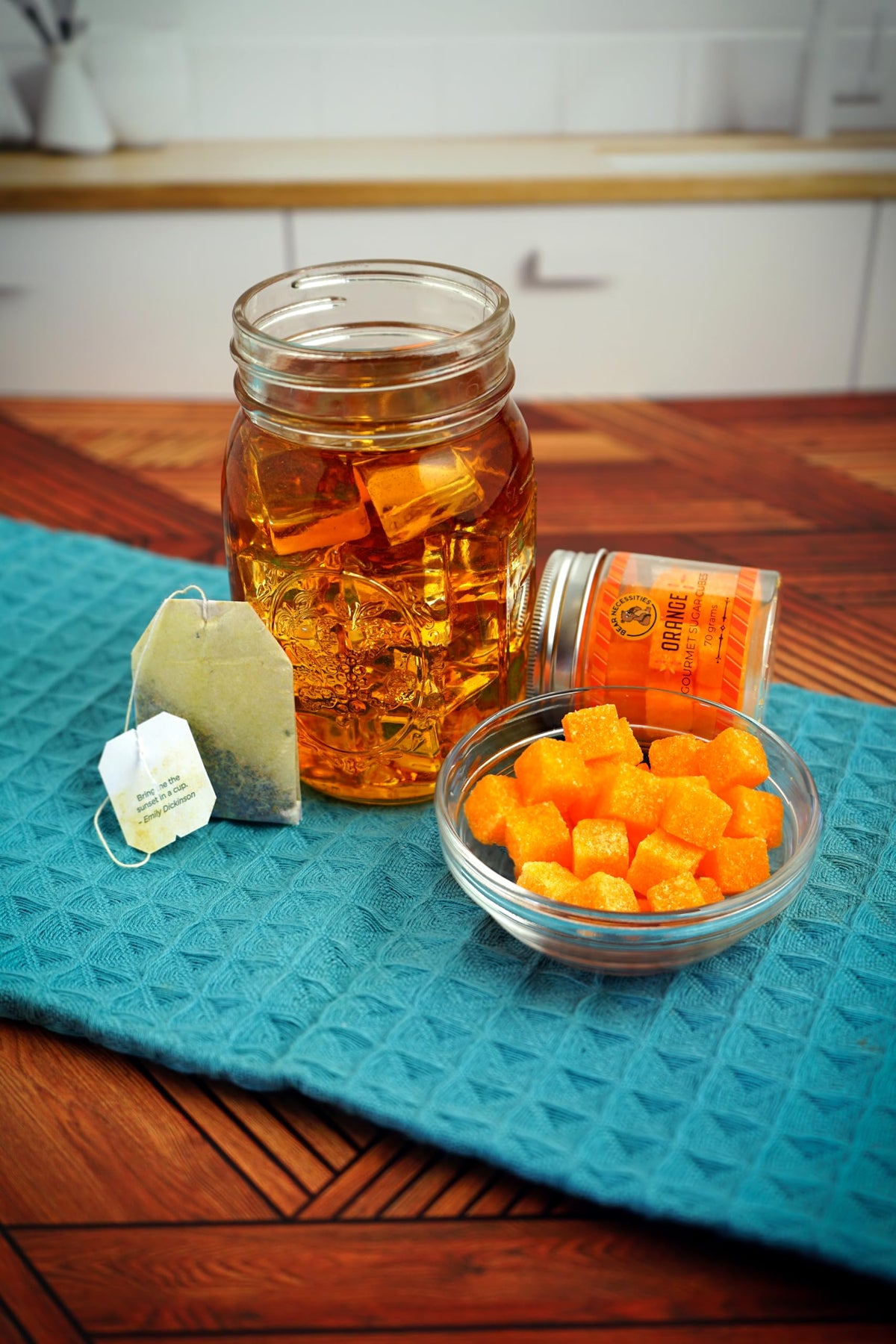 Bear Necessities handcrafted sugar cubes beside a glass for an Old Fashioned or Aperol Spritz.