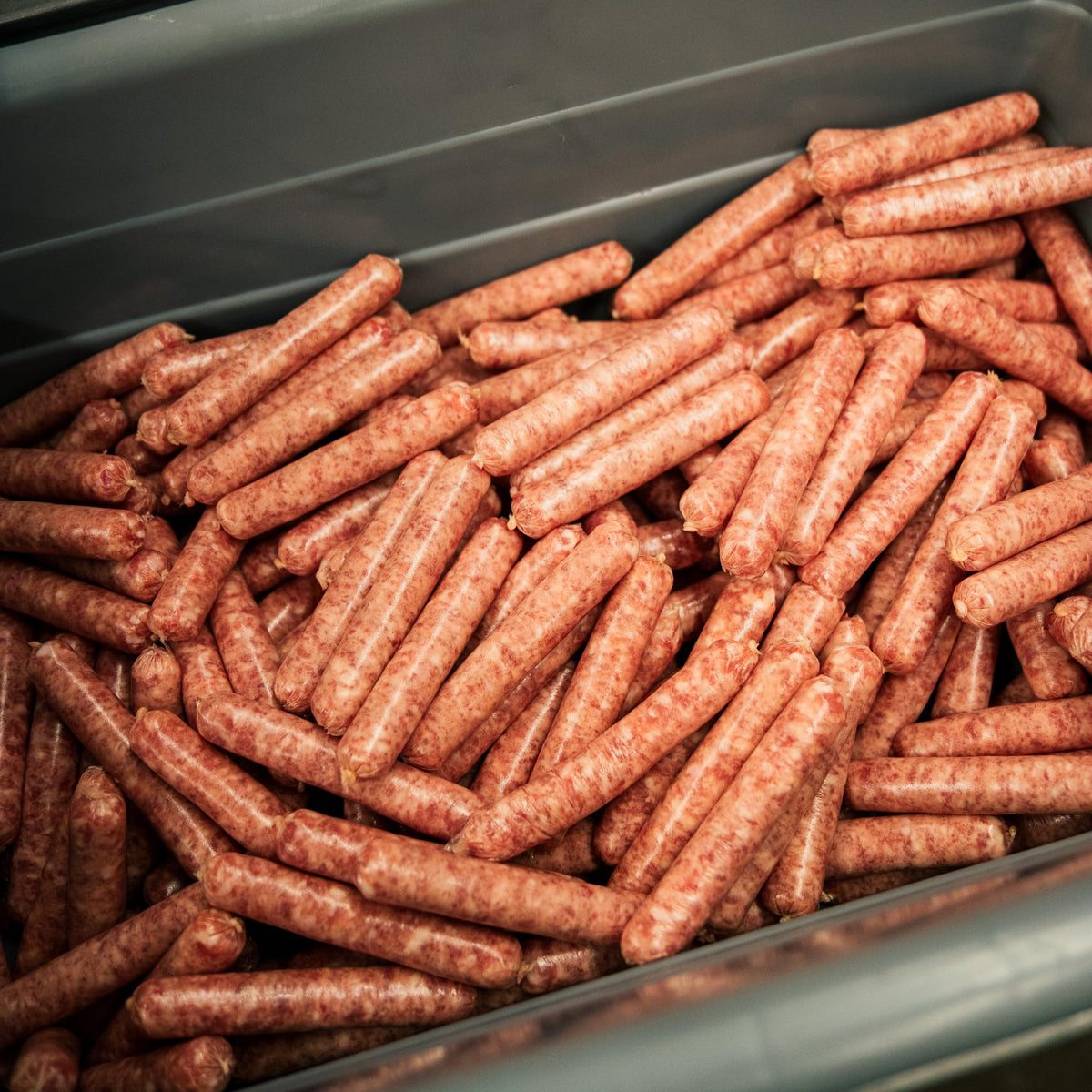 Bearded Butchers Country Style Seasoning being mixed into meat for consistent flavor.