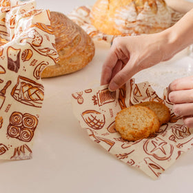 Bee's Wrap snack bag shows Bakery Lane print, reusable alternative to plastic.