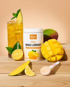 Pouring Bella All Natural Raspberry Lemonade reveals vibrant pink color and real fruit
