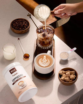 Bella All Natural Probiotics Cappuccino Coffee mug with creamy foam.