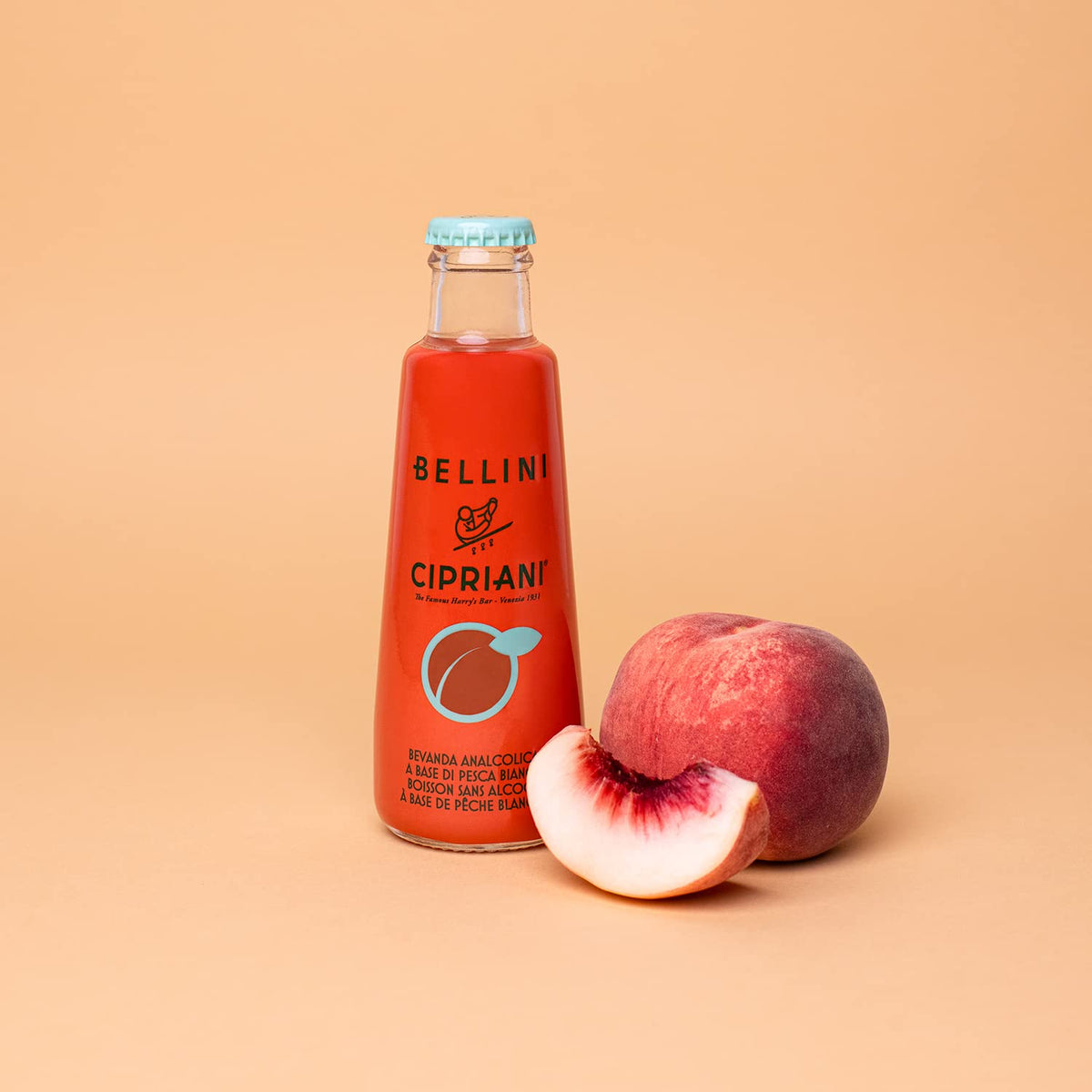 Bellini Cipriani white peach mix being poured into a flute, perfect for celebrations.