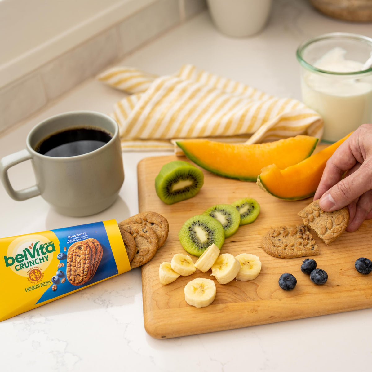 Office desk scene with Belvita-Clif variety pack for quick snacking.