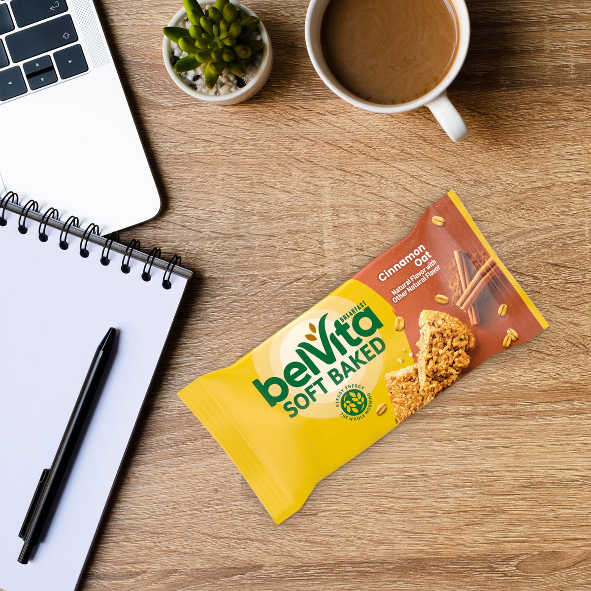 Belvita Soft Baked Cinnamon Oat Bar being opened for a soft bite.